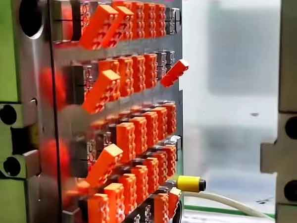 Toy manufacturing injection molding machine